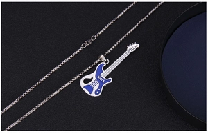 Detailed close-up of a blue enamel electric guitar pendant on a silver square link chain