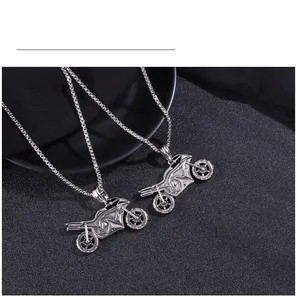 Detail shot of vintage motorcycle pendant showing intricate silver metal textured structure