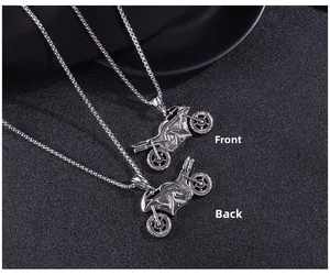 Detailed macro view showing the front and back of the vintage motorcycle pendant necklace