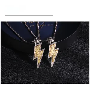 Detailed view of hip hop lightning pendants with yellow and white micro-paved rhinestones