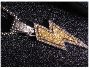 Close-up of hip hop lightning bolt pendant with sparkling crystals and box chain