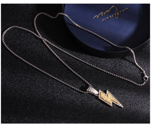 Close-up of hip hop lightning pendant with micro-paved yellow and white zircons