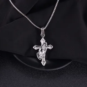 Back side view of punk stainless steel cross pendant with praying hands relief