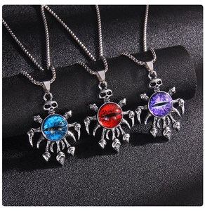Macro detail of gothic evil eye pendants in blue red and purple with skull accents