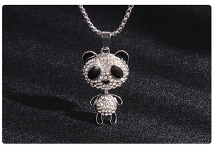 Detailed close-up of a panda pendant necklace with sparkling crystal rhinestones