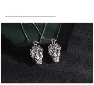 Close-up of vintage dragon head pendant with detailed silver metallic texture