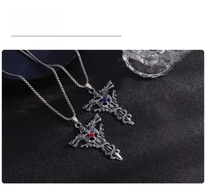 Detailed shot of punk double dragon cross pendant necklaces with red and blue crystals