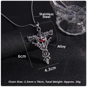 Detail of silver dragon sword cross pendant with red gemstone and stainless steel chain
