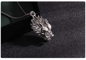 Detailed macro shot of vintage silver wolf head pendant with realistic textures