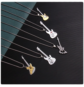 Detailed macro shot of diverse electric guitar pendants with metallic polished finish