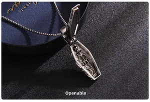Macro shot of an openable gothic coffin pendant with internal skeleton engraving detail