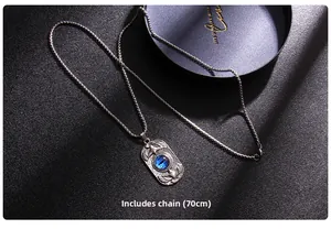Macro detail of Turkish evil eye necklace with eagle relief and 70cm chain