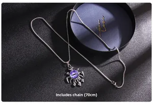 Macro view of purple evil eye pendant with skull accents and silver steel chain detail