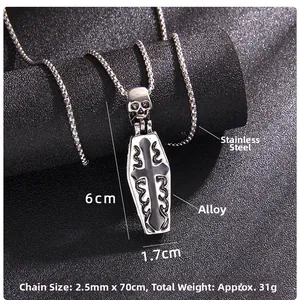 Detail shot of gothic coffin pendant and skull necklace with size measurements