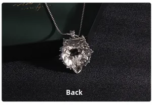 Macro shot showing the detailed textured back structure of the silver wolf head pendant