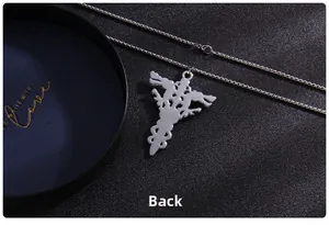 Detailed back side view of silver punk double dragon cross necklace in dark studio lighting