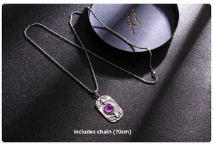 Detailed view of evil eye necklace featuring eagle wings and 70cm chain