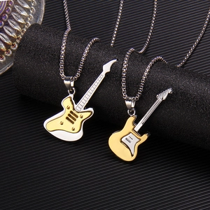 Dual-tone electric guitar pendant necklace with silver pearl chain on black display stand