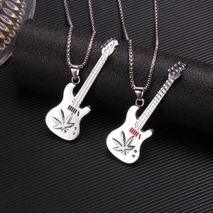Minimalist guitar pendant necklace with leaf engraving on a classic bead chain
