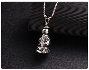 Macro shot of punk skull lantern pendant with vintage textured finish and silver chain