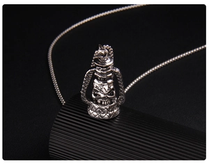 Detailed close-up of a vintage punk skull lantern pendant with antique silver finish