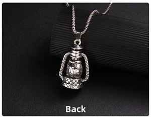 Macro shot of the vintage kerosene lamp skull pendant's textured back and square chain