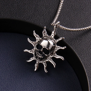 Gothic silver flame skull pendant necklace with sunburst detail and round box chain