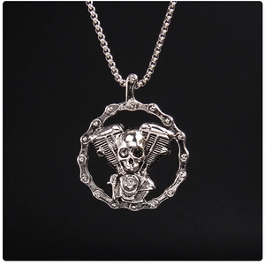 Macro detail of gothic skull pendant with engine cylinders in heavy metal silver style