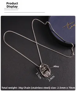 Detail shot of vintage skull pendant in antique silver finish with stainless steel chain