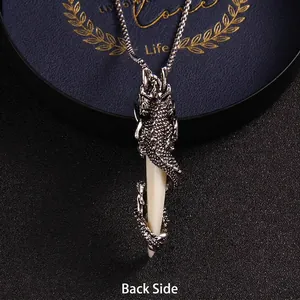 Retro stainless steel dragon coiled wolf tooth pendant necklace showing detailed back view
