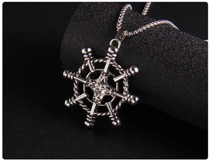 Macro shot of retro nautical anchor pendant with detailed vintage silver plating