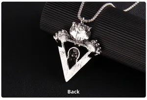 Detailed back view of silver punk skull pendant showing intricate embossed metal textures