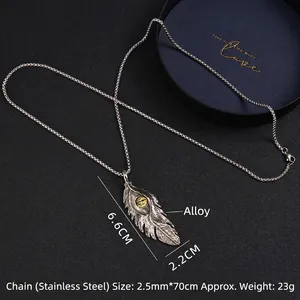 Collier vintage avec pendentif plume œil turc en argent antique et chaîne en acier inoxydable