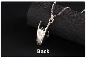 Macro detail showing the smooth back view of rock sign pendant and stainless steel chain