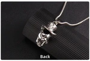 Detailed macro view showing the back side of silver gothic skull pendant necklace