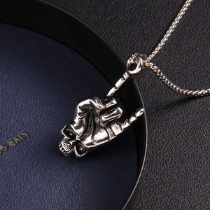 Punk style stainless steel skull hand gesture rock pendant necklace with vintage silver finish