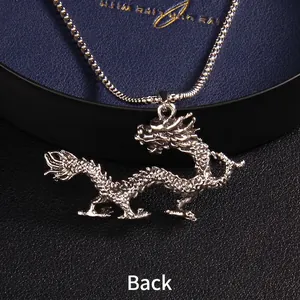 Silver dragon pendant necklace made of stainless steel showing detailed back view engraving