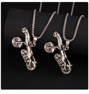 Detailed close-up of retro silver leopard motorcycle pendant with chunky chain