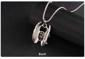 Detailed back view of a silver gothic skull pendant showing metallic texture and structure