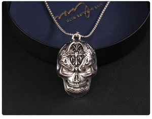 Macro detail of gothic skull pendant with cross carving and oxidized silver finish