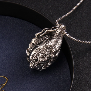 Retro Buddha and Demon pendant necklace in vintage silver finish with textured square chain