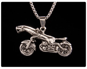 Detailed close-up of a silver punk leopard motorcycle pendant necklace with vintage finish