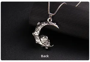 Detailed back view of silver gothic skull and crescent moon necklace on leather