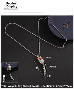 Detail view of retro ethnic wolf tooth pendant in alloy and acrylic with steel chain