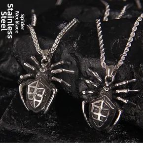 Close-up of stainless steel spider pendants on twisted rope and snake chains