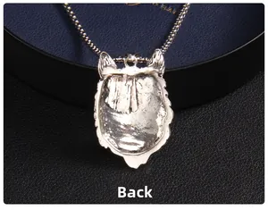 Detailed back view of silver wolf head pendant with textured casting and chain