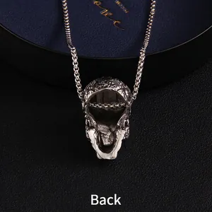Back view of silver punk skull pendant necklace with hollow structure on box chain