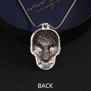 Retro silver skull pendant necklace in punk gothic style shown from back view perspective