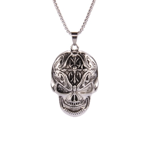 Gothic silver skull pendant necklace with cross detail in punk hip-hop style on white background