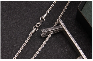 Close-up of silver stainless steel twisted rope chain with a secure lobster clasp closure
